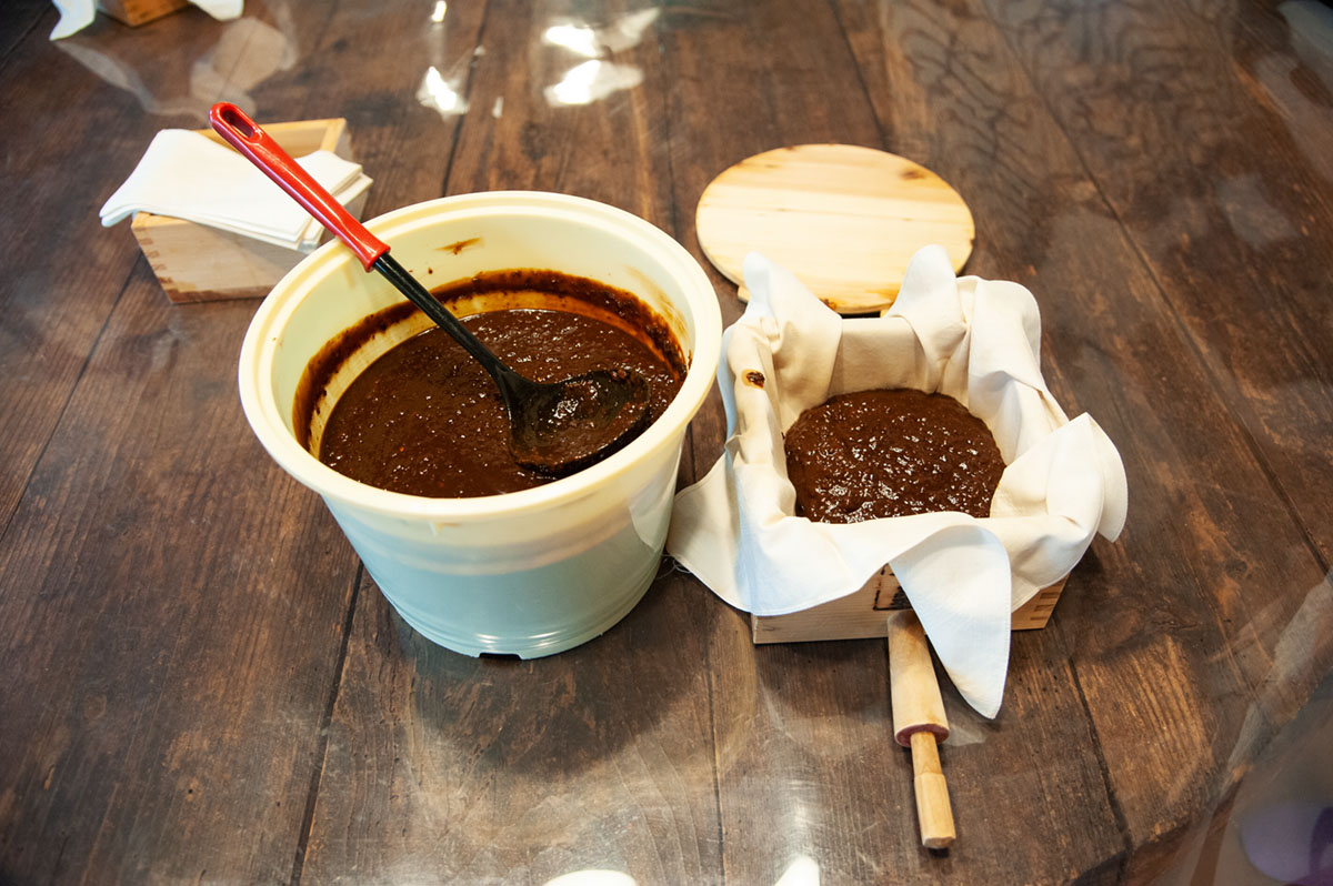 Preparing to press moromi into soy sauce